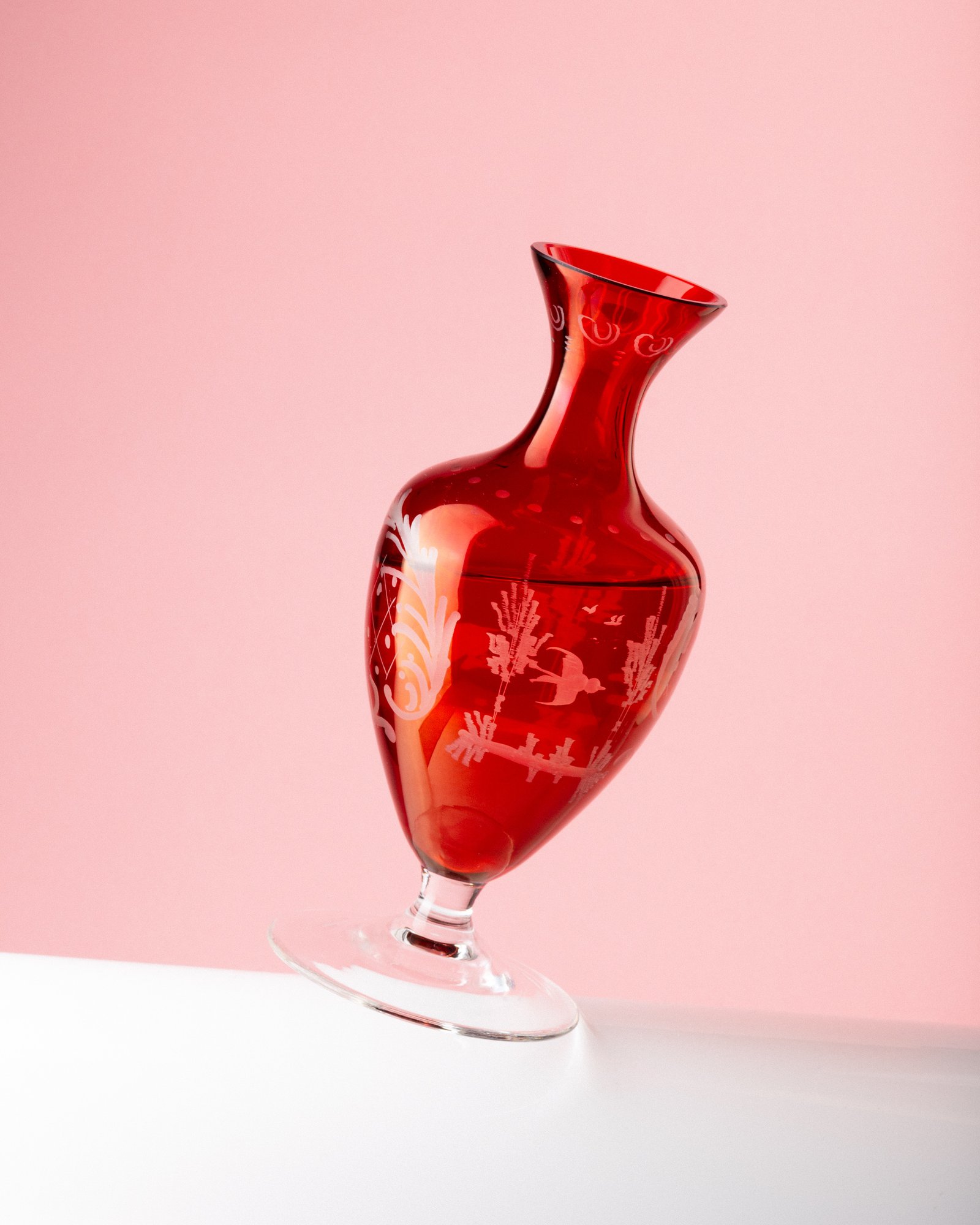 tilted red vase